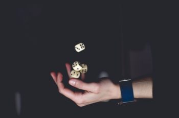 a person throwing dices in the air