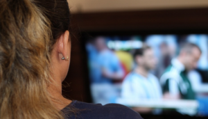 a woman watching football